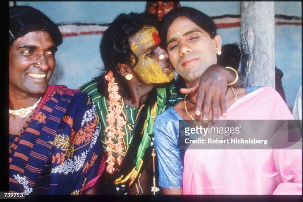 Eunuchs embrace in a hotel room April 24, 1994 in Villupuram, India. Eunuchs, called "hijras" are mostly men castrated at puberty, were once invited...