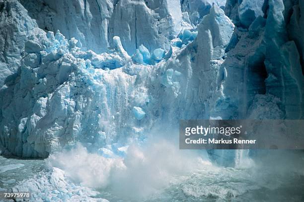 ice breaking off a glacier - glacier calving stock pictures, royalty-free photos & images