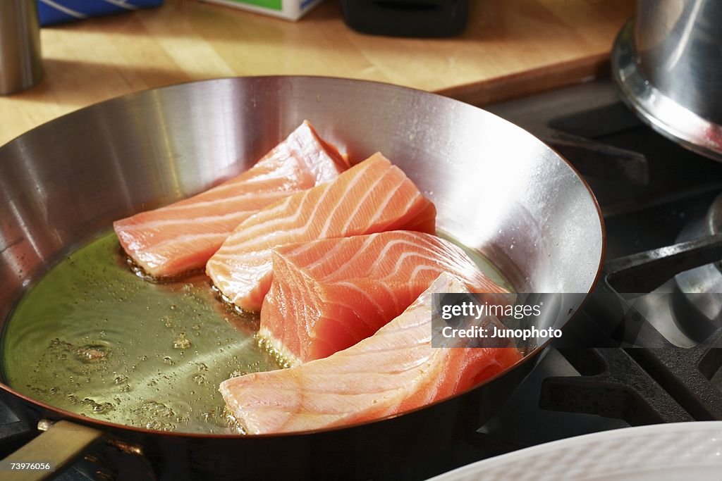 Fresh Salmon Frying In A Pan High-Res Stock Photo - Getty Images