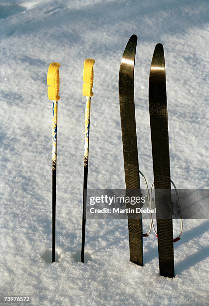 skis and ski poles in the snow - pair stock pictures, royalty-free photos & images