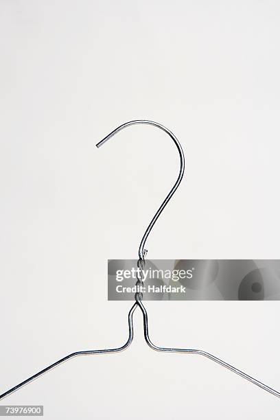 a wire clothes hanger - coat hanger stock-fotos und bilder