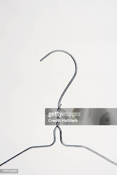 a wire clothes hanger - coathanger foto e immagini stock