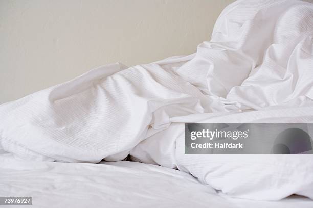 crumpled bed sheets - duvet stock pictures, royalty-free photos & images