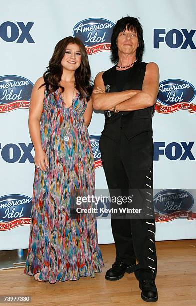 Singer Kelly Clarkson and musician Jeff Beck pose in the press room during the "American Idol Gives Back" held at the Walt Disney Concert Hall on...