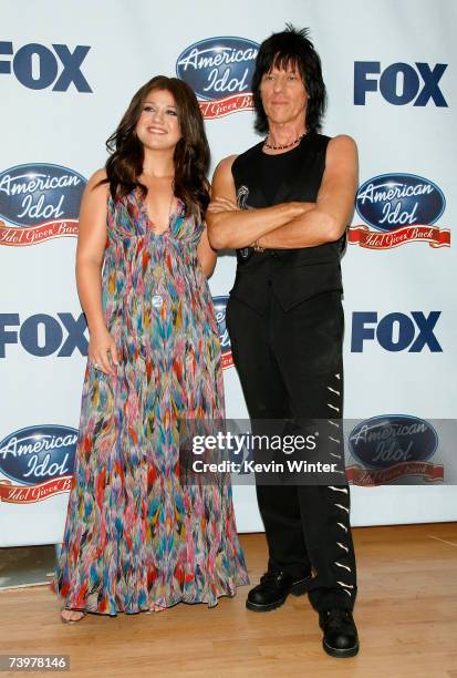 Singer Kelly Clarkson and musician Jeff Beck pose in the press room during the "American Idol Gives Back" held at the Walt Disney Concert Hall on...