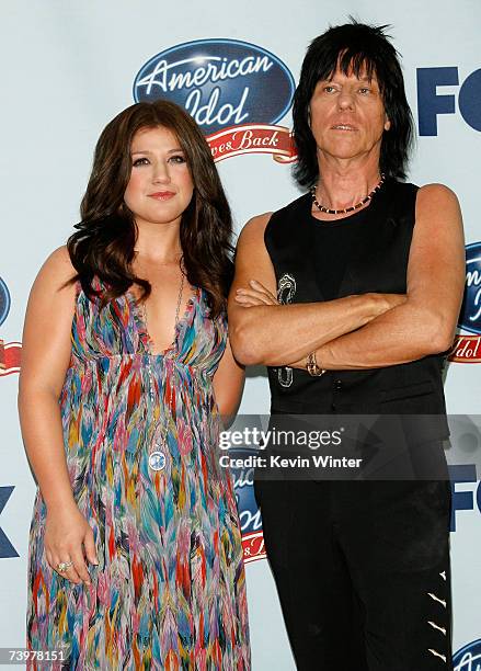 Singer Kelly Clarkson and musician Jeff Beck pose in the press room during the "American Idol Gives Back" held at the Walt Disney Concert Hall on...