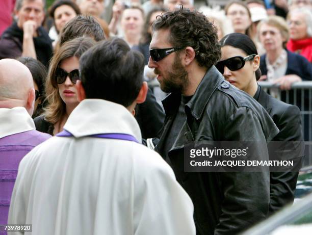 French actor Vincent Cassel , arrives with his sister Cecile and his companion Italian actress Monica Bellucci at Saint-Eustache's church for the...