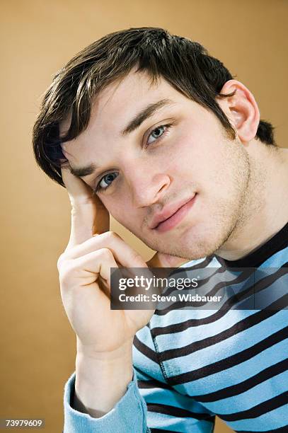 Resting Head Young Man Resting Head On Hand Portrait High-Res Stock Photo - Getty Images
