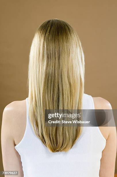 young woman with long hair, rear view - long blonde hair stock pictures, royalty-free photos & images