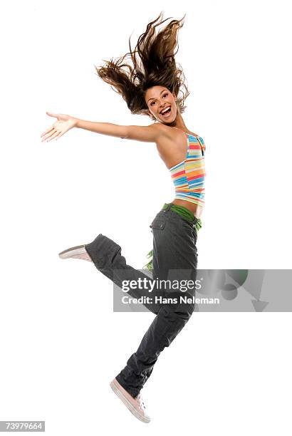 girl jumping into air - scuotere i capelli foto e immagini stock