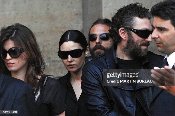 French actor Vincent Cassel , his companion Italian actress Monica Bellucci and his sister Cecile leave Saint-Eustache's church after the funeral...