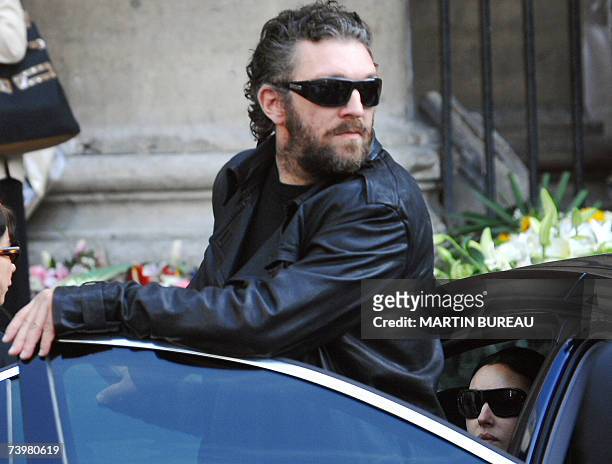 French actor Vincent Cassel and his companion Italian actress Monica Bellucci leave Saint-Eustache's church after the funeral mass of his father...