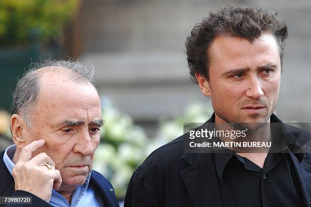 French actor Claude Brasseur and his son Alexandre leave the Saint-Eustache's church after attending the funeral mass of French actor Jean-Pierre...