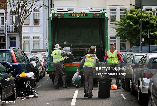Bags of rubbish are collected on a domestic street in Clapham on April 26 2007 in London. Many councils in the UK are considering introducting...
