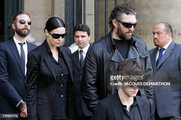 French actor Vincent Cassel , flanked by his companion Italian actress Monica Bellucci and French actor Gaspardd Uliel , leaves Saint-Eustache's...