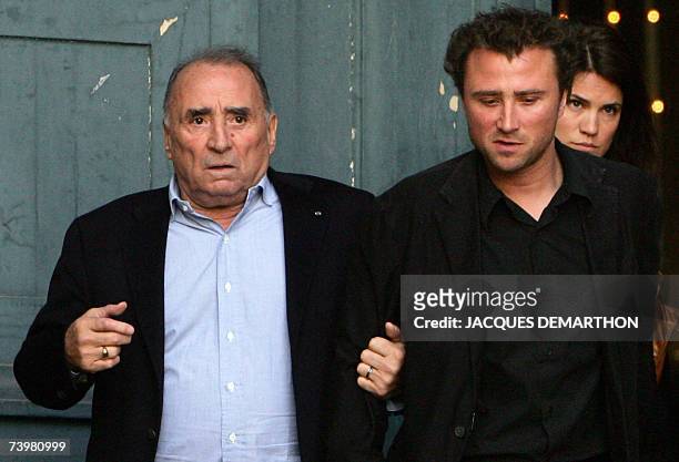 French actor Claude Brasseur leaves Saint-Eustache's church with his son Alexandre after the funeral mass of French actor Jean-Pierre Cassel, 26...