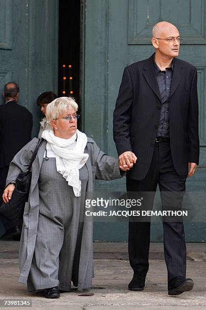 French actress Mimie Mathy and her husband Benoist Gerard leaves the Saint-Eustache's church after attending the funeral mass of French actor...