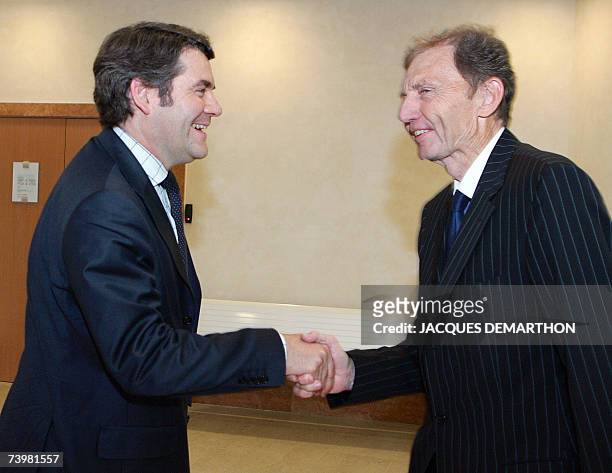 Franck Louvrier, the communication advisor of French right-wing UMP presidential candidate Nicolas Sarkozy, shakes hands with Etienne Mougeotte,...