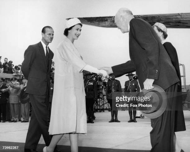 Queen Elizabeth greets US President Dwight D. Eisenhower before they take part in the opening ceremony of the St. Lawrence Seaway at Lambert Lock,...