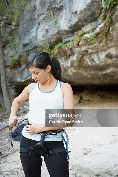 woman preparing to rock climb - chalk bag stock pictures, royalty-free photos & images