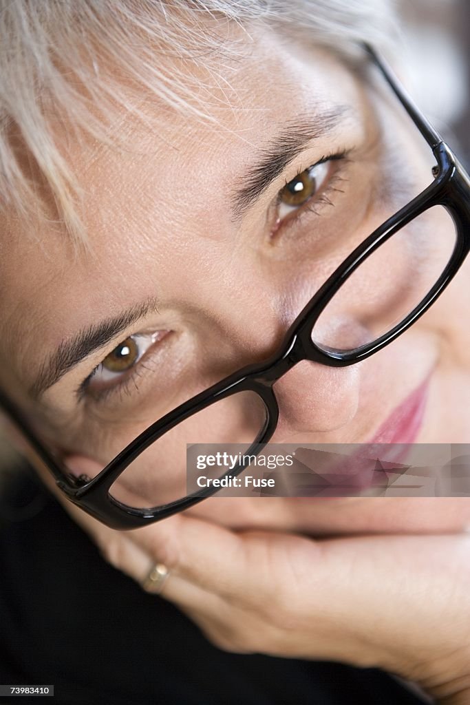 Look Over Spectacles Woman Looking Over Glasses High-Res Stock Photo - Getty Images
