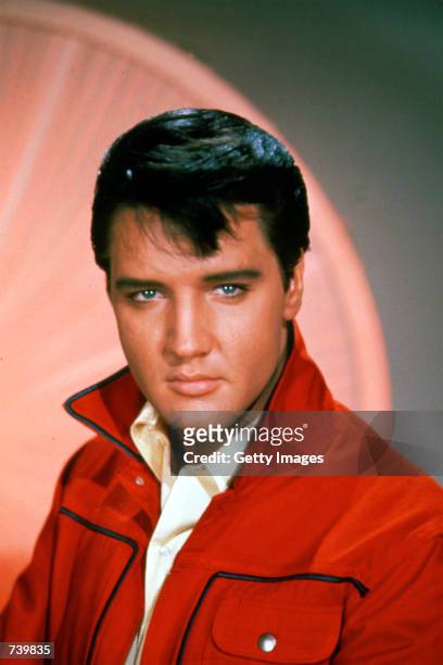 Singer Elvis Presley poses for a studio portrait.