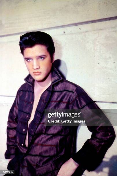Singer Elvis Presley poses for a studio portrait.