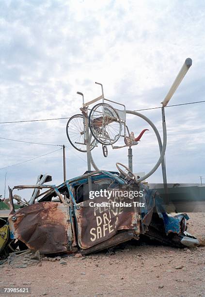 car wreck assemblage on a roadside - funny safety signs stock pictures, royalty-free photos & images