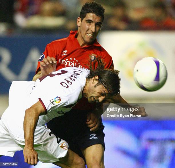 Raul Garcia of Osasuna is beaten to the ball by Javi Navarro of Sevilla during the UEFA Cup Semi Final first leg match between Osasuna and Sevilla at...