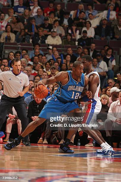 Dwight Howard of the Orlando Magic moves the ball against Antonio McDyess of the Detroit Pistons in Game Two of the Eastern Conference Quarterfinals...