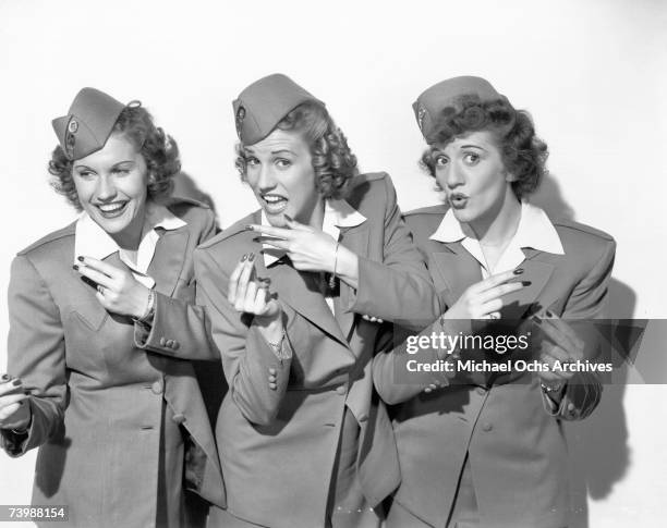 Singing group The Andrews Sisters pose for a portrait circa 1944 in New York City, New York.