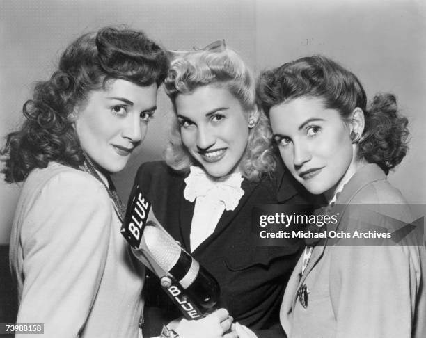 Singing group The Andrews Sisters pose for a portrait circa 1944 in New York City, New York.