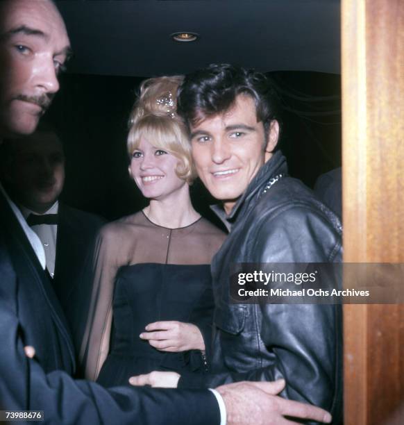 Actress Brigitte Bardot and British singer Vince Taylor pose for a photo circa 1962 in France.