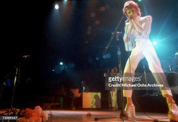 Musician David Bowie performs onstage during his "Ziggy Stardust" era in 1973 in Los Angeles, California.