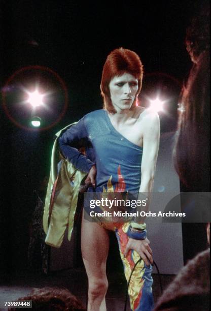 Musician David Bowie performs onstage during his "Ziggy Stardust" era in 1973 in Los Angeles, California.