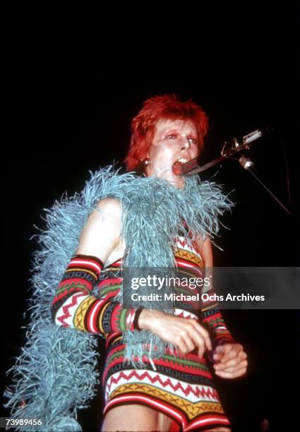 Musician David Bowie performs onstage during his "Ziggy Stardust" era in 1973 in Los Angeles, California.