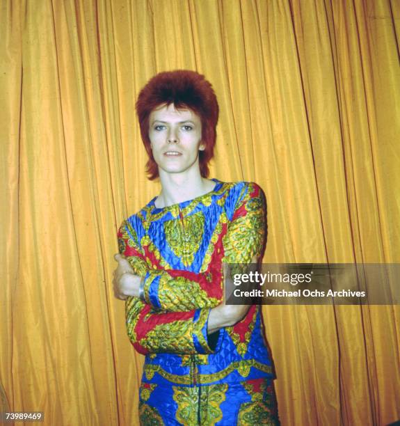 Rock and roll musician David Bowie poses for a portrait dressed as 'Ziggy Stardust' in a hotel room in 1973 in New York City, New York.