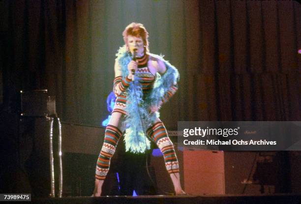 Musician David Bowie performs onstage during his "Ziggy Stardust" era in 1973 in Los Angeles, California.