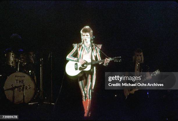 Musician David Bowie performs onstage during his "Ziggy Stardust" era in 1973 in Los Angeles, California.