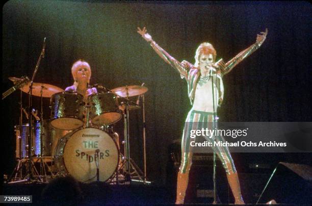 Musician David Bowie performs onstage during his "Ziggy Stardust" era in 1973 in Los Angeles, California.