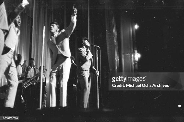 "Godfather of Soul" James Brown performs with The Famous Flames at the Apollo Theater in 1964 in New York, New York.