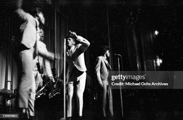 "Godfather of Soul" James Brown performs with The Famous Flames at the Apollo Theater in 1964 in New York, New York.