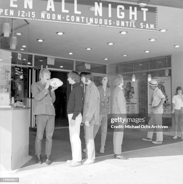 Supergroup "Buffalo Springfield" perform pose for a portrait outside a movie theatre in 1966 in Hollywood, California. Dewey Martin, Richie Furay,...