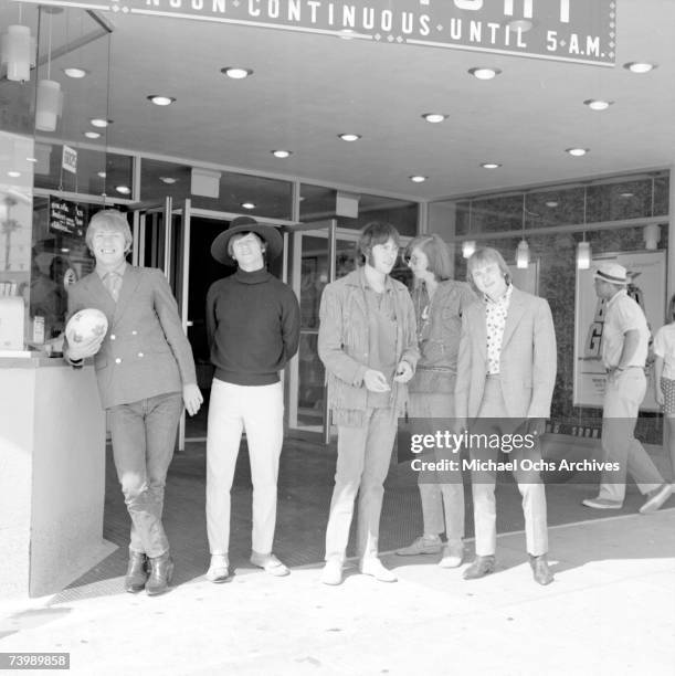 Supergroup "Buffalo Springfield" perform pose for a portrait outside a movie theatre in 1966 in Hollywood, California. Dewey Martin, Richie Furay,...