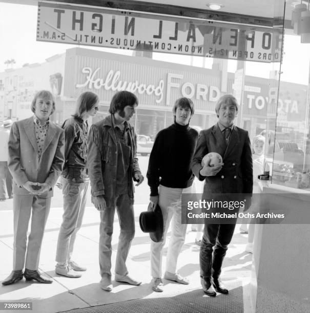 Supergroup "Buffalo Springfield" perform pose for a portrait outside a movie theatre in 1966 in Hollywood, California. Stephen Stills, Bruce Palmer,...