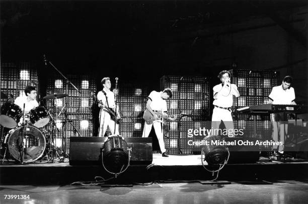 Alan Myers, Bob Mothersbaugh, Bob Casale, Mark Mothersbaugh and Gerald Casale of the new wave punk music group "Devo" perform onstage in circa 1979...