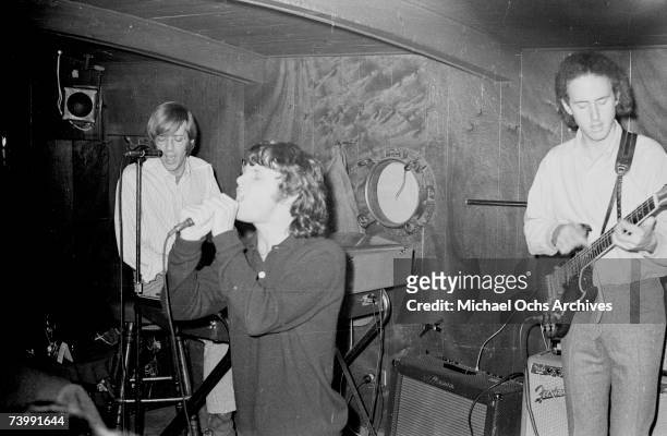 November 1966: Keyboardist Ray Manzarek, singer Jim Morrison and guitarist Robby Krieger of the rock and roll band "The Doors" perform onstage at...
