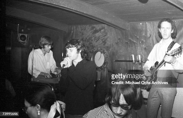 November 1966: Keyboardist Ray Manzarek, singer Jim Morrison and guitarist Robby Krieger of the rock and roll band "The Doors" perform onstage at...