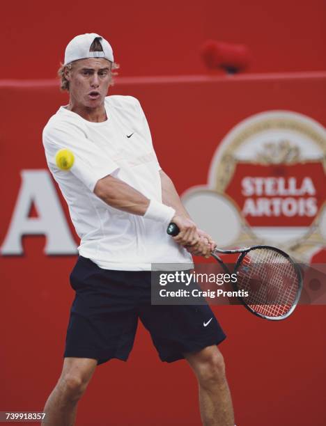 Lleyton Hewitt of Australia makes a double backhand return on his way to victory over Byron Black of Zimbabwe during their Men's Singles third round...