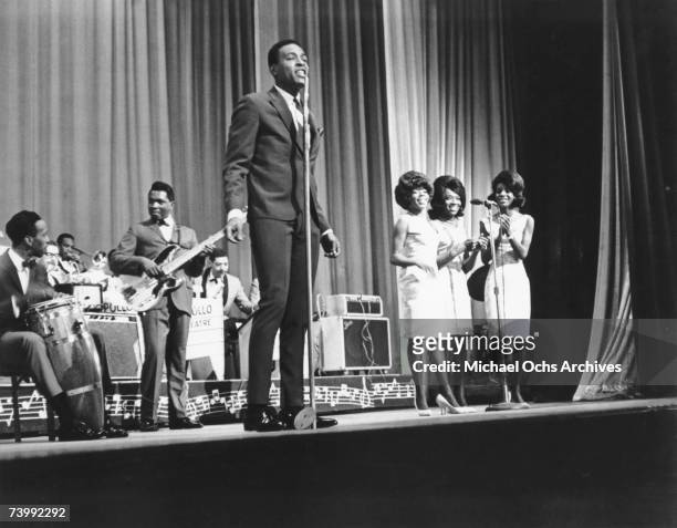 Singer Marvin Gaye performs onstage at the Apollo Theater with female R&B vocal group "Martha & The Vandellas" in 1962 in New York City, New York.